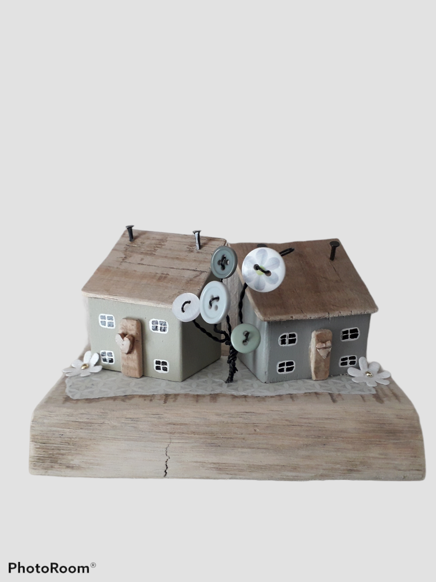Two Wooden Houses With Wire And Button Tree